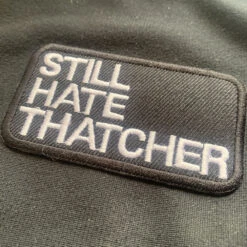 Still Hate Thatcher Half Zip Sweat Top -Tshirt Store still hate thatcher patch 1000x1000 1